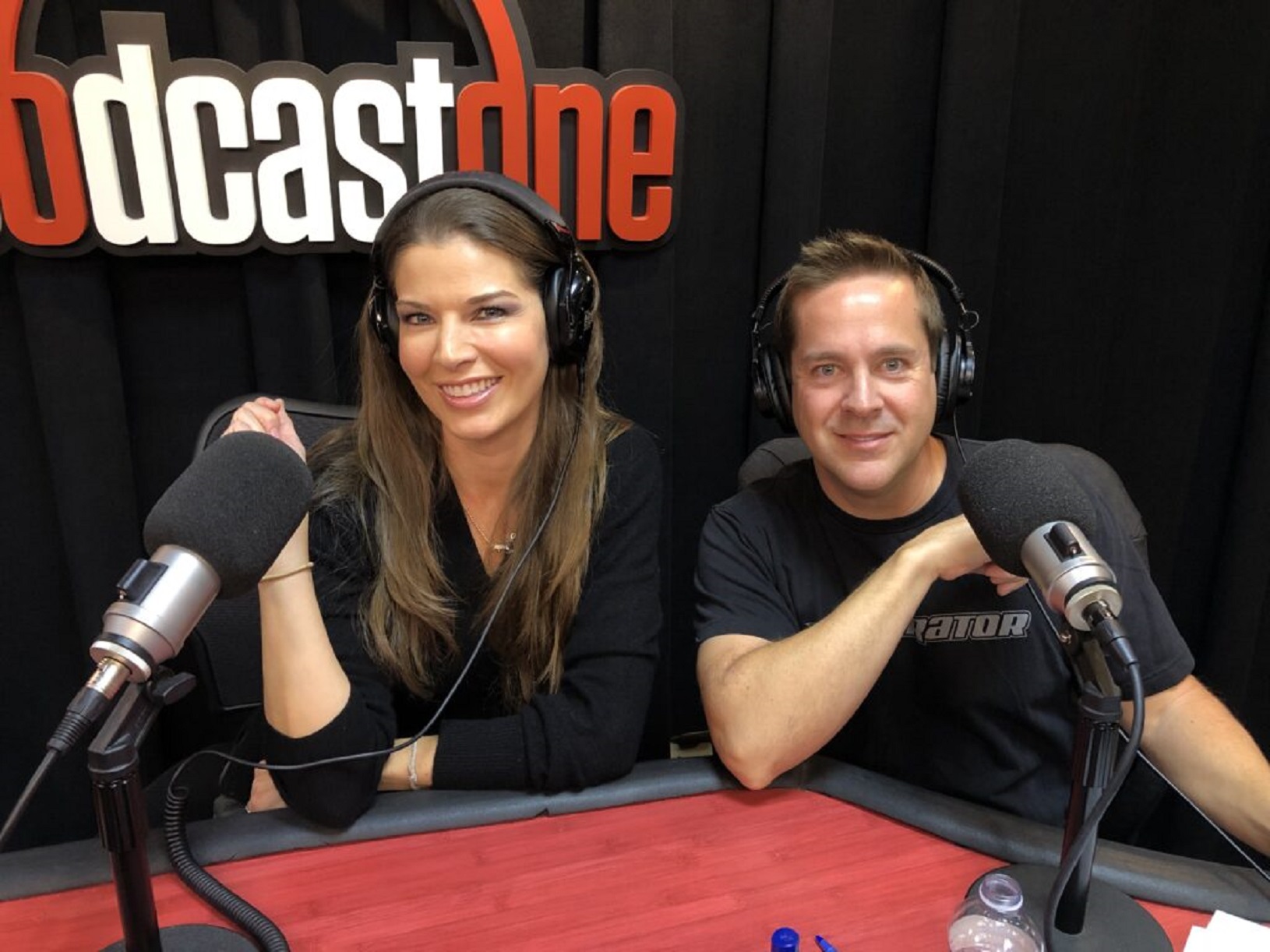 man and woman with headphones on