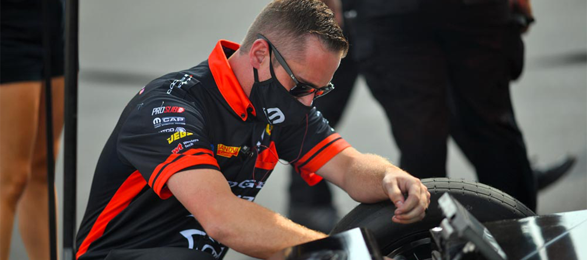 Alex Conway working on a vehicle